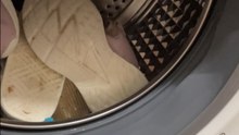 Girl puts sneakers in washing machine and ends up with a bigger mess