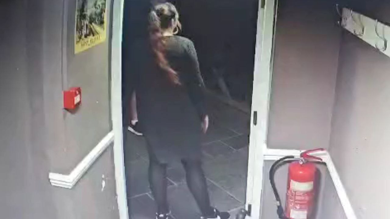 Girl sheltering from wind gets smacked by door in a hilarious fail