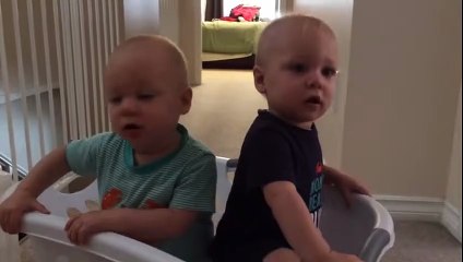 Adorable twins imitating their mom