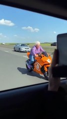 Elderly Woman Proves Age is Just a Number on Orange Sport Bike