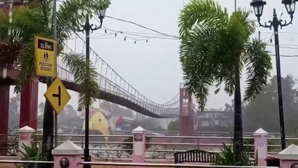 Typhoon Fung-Wong rocks walking bridge in Philippines