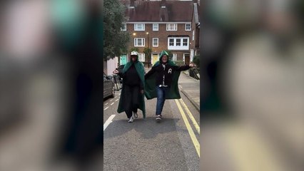 Alan Carr and Cat Burns dress up in their Traitors cloaks