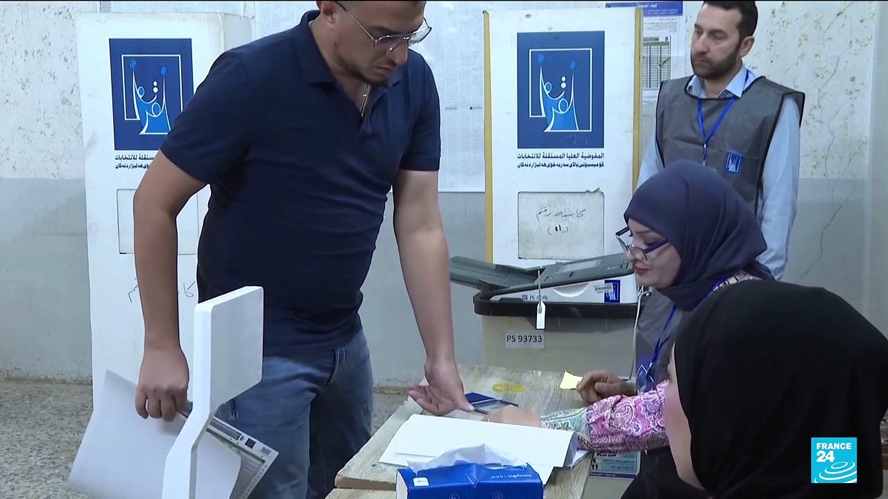 Iraqis vote in a parliamentary election marked by tight security and a political boycott