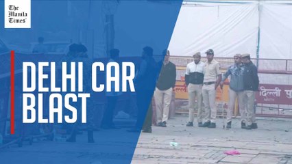 Forensics and police survey scene morning after blast near Delhi's Red Fort