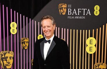 Richard E. Grant is happy with travelling solo