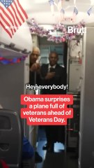 Obama greets a flight of veterans and their families on Veteran's Day.