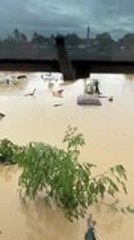 People Gather on Rooftops Amid Flooding in Philippines