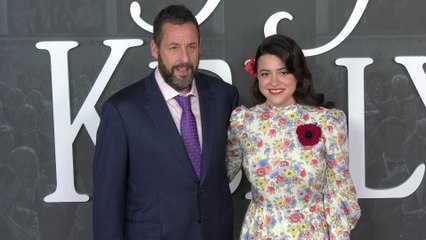 Adam Sandler and Grace Edwards attend the red carpet premiere of Netflix's "Jay Kelly" in Los Angeles