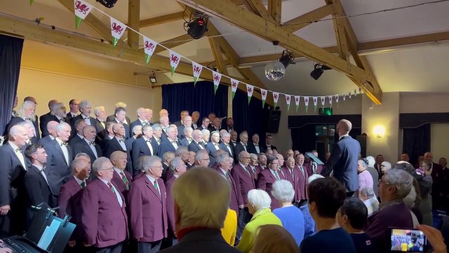 Monmouth and Dunvant Male Voice Choirs sing the Welsh National anthem at this year's St David's Day concert