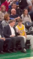 Mavericks owner Patrick Dumont chats with fan wearing a Lakers Luka Dončić jersey Monday night