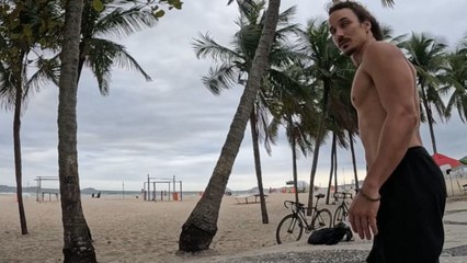 Boy tries to do acrobatics on coconut trees at Copacabana beach but falls