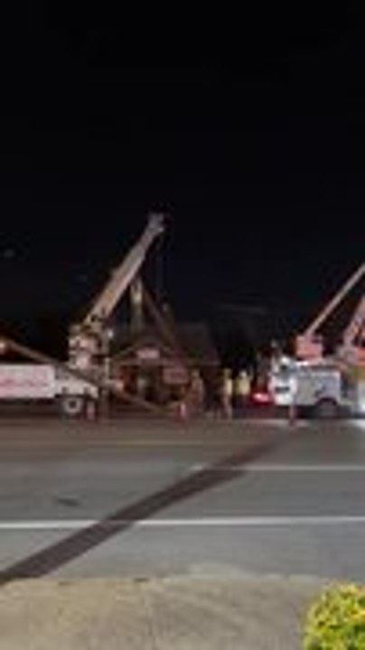 Worker Is Lifted High Off Ground After Clinging to Pole Pulled by Crane