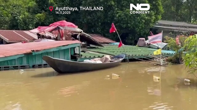 Flooding forces Thai man to live on his roof for weeks