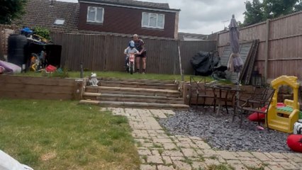 Little boy rides his first bike down the stairs and takes a fall