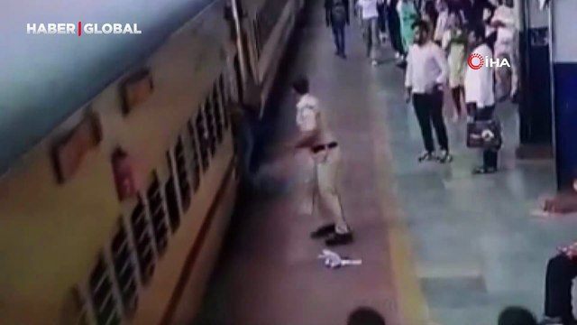 Hindistan'da hareket eden trene binmeye çalışan kadın ezilmekten kıl payı kurtuldu