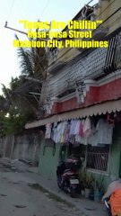 Teens are Chillin' on Hasa-hasa Street in Malabon City in the Philippines