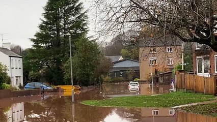 Somerset Road was partly under water, with a car half submerged