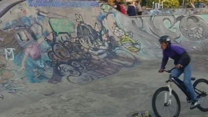 Boy tries a backflip on his bike but misses the landing and falls hard