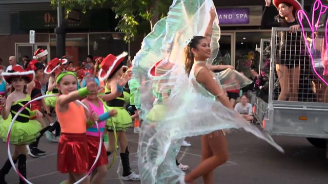 Christmas arrives early in Darwin as local communities celebrate in a festive street parade.