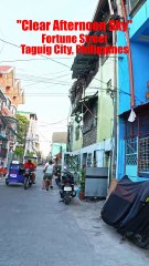 Clear Afternoon Sky on Fortune Street in Taguig City in the Philippines