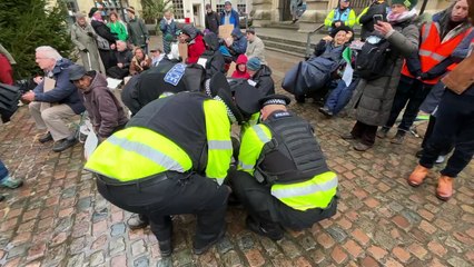 Arrest being made during the Defend Our Juries' "Lift The Ban" protest outside Truro Cathedral. Credit: Lee Trewhela/LDRS