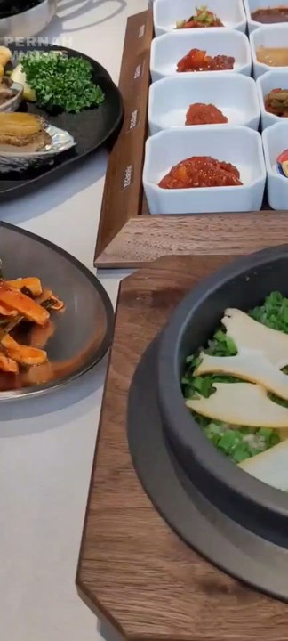 preparation for a menu of octopus, shellfish, grilled fish and soy sauce rice