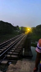 Near-Miss Train Accident! Man Survives Terrifying Fall from Railway Bridge in Bangladesh