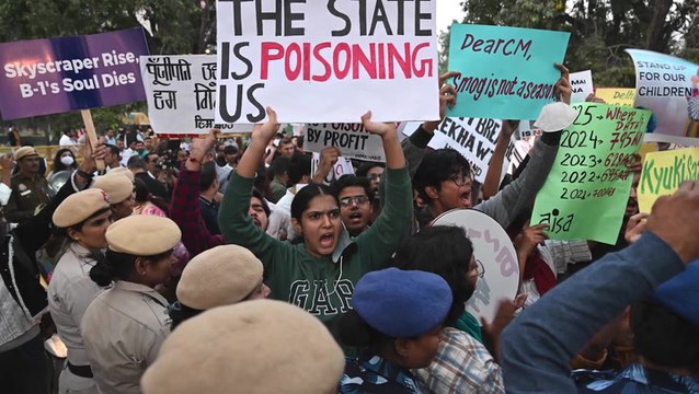 Angry protesters wearing masks and carrying oxygen cylinders demand answers over ‘toxic’ Delhi air