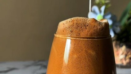 Coffee mixed and blended into frothy dalgona cream over iced milk