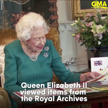 Queen Elizabeth II admires items from the Royal Archives ahead of Platinum Jubilee