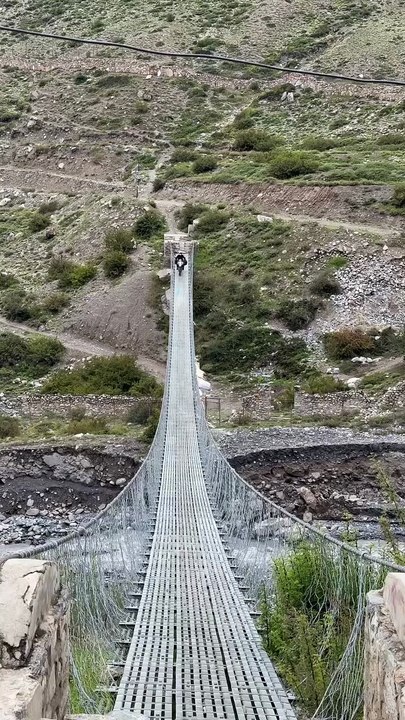 Crossing a Suspension Bridge in Lower Mustang, Nepal