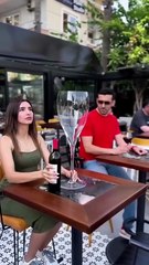 Woman Taking Giant Glass of Wine And Man Taking A Giant Cup of Coffee