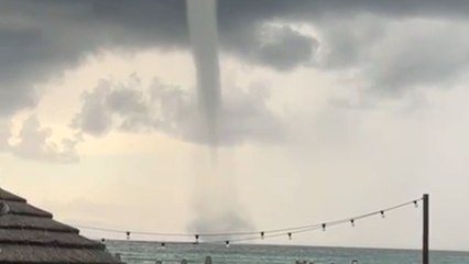Rare waterspout over Cagliari waters leaves onlookers amazed