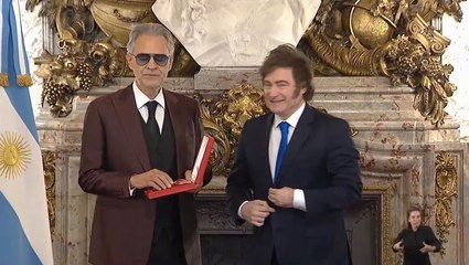 Awkward moment Argentina’s president holds his hand out for blind tenor Andrea Bocelli to shake