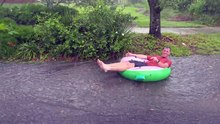 Florida Man Goes Tubing Down Rain-Drenched Street