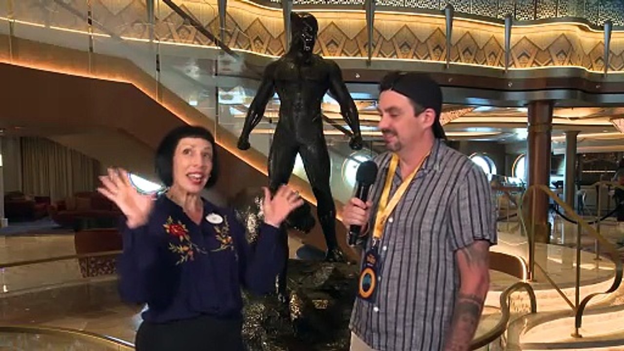 Coop chats with Jen Bascom on the Grand Hall aboard Disney Destiny