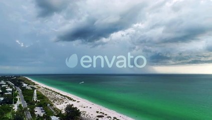 Dark Stormy Clouds Forming on Gloomy Sky During Heavy Rainfall Season Over Sea Water Near Suburban
