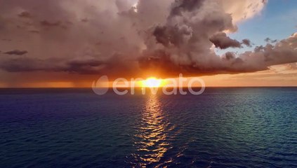 Dark Stormy Clouds Forming on Gloomy Sky During Heavy Rainfall Season Over Sea Surface in Evening
