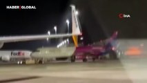 Almanya'da havalimanında panik: Acil çıkış kapısını kırarak piste daldılar