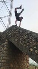 Man Climbs Down Flight of Stairs by Performing Handstand