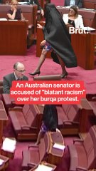 An Australian senator was accused of racism over burqa protest.