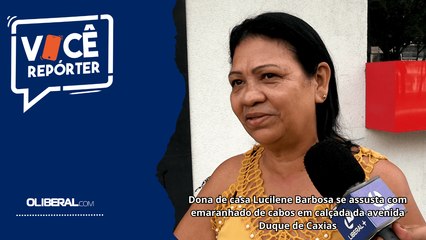 Dona de casa Lucilene Barbosa se assusta com emaranhado de cabos em calçada da avenida Duque de Caxias