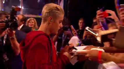 Justin Bieber Is Now Taking Photos & Giving Out Hugs - VIDEO