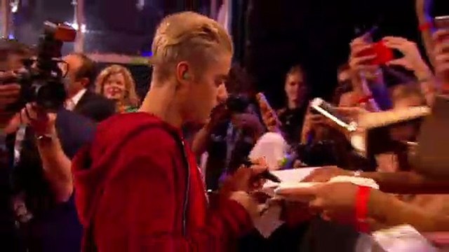 Justin Bieber Is Now Taking Photos & Giving Out Hugs - VIDEO