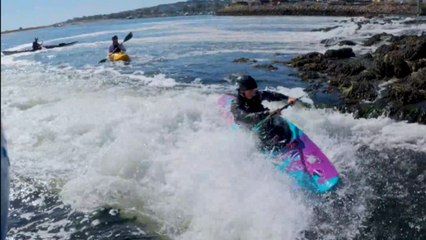 Retentive wave tries to take a kayaker down but he holds his ground