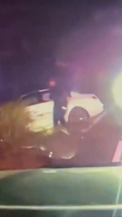 Heroic cops pull unconscious man from wreck seconds before flames engulf car