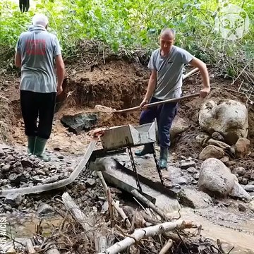 Gold Panning Prospecting in a river bed
