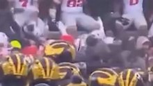 Michigan players guard 'M' logo after OSU's rivalry win