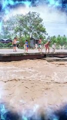 Kids Daring Jump into Muddy, Flooded River During High Water | Extreme River Play