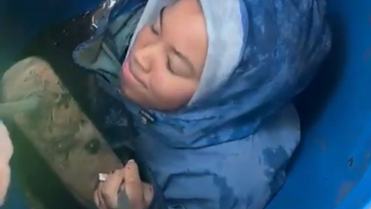 Camper makes her way out of an underground tunnel in a challenging manner